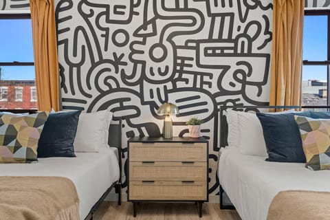 Enjoy the unique details of this stylish bedroom. The cool mural adds a touch of Philly flair!
