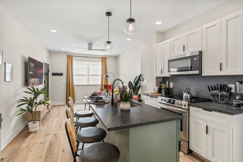Open flow, vibrant details, and modern touches make this space effortlessly livable.