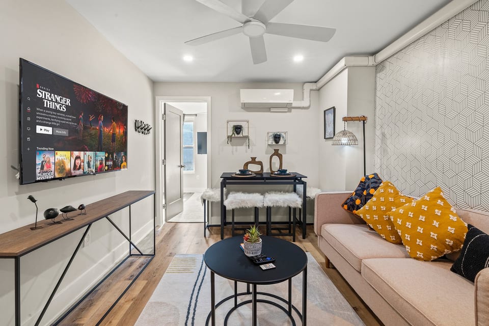Modern comfort meets character in this bright living space—stream shows or unwind before heading out to explore.