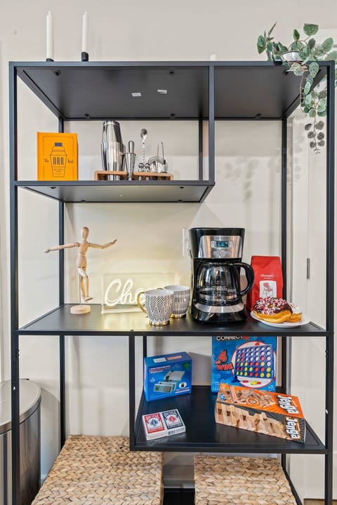 Cook, sip, and snack in style—this bright kitchen blends modern finishes with thoughtful hospitality touches.