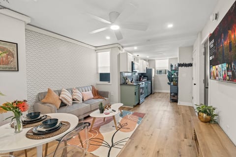 Open-concept flow from lounge to kitchen, blending urban style and cozy comfort for your Philly stay.