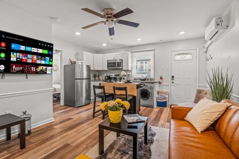 Enjoy the modern elegance of this open-concept kitchen and living area. You will love the fully equipped kitchen, sleek dining space, and cozy living room, perfect for relaxing and enjoying your stay.