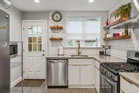 Open layout flows from dining to kitchen, blending modern finishes and everyday functionality.