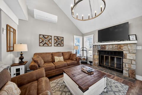 enjoy the fireplace, comfy couches and chair after a long day of skiing