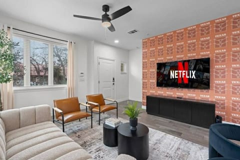 Room for 5 plus the dining room chairs to relax and watch this 65" TV.