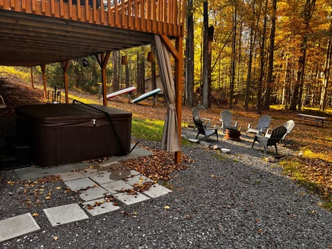 Private hot tub and fire pit in a peaceful wooded setting