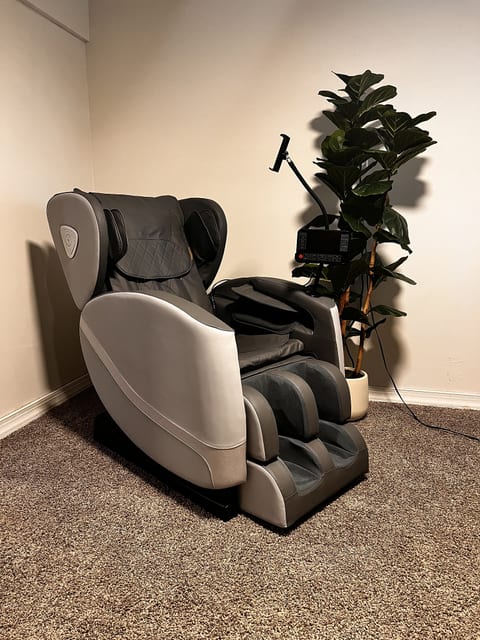 Unwind in a luxe full-body massage chair with a calming spa-like vibe