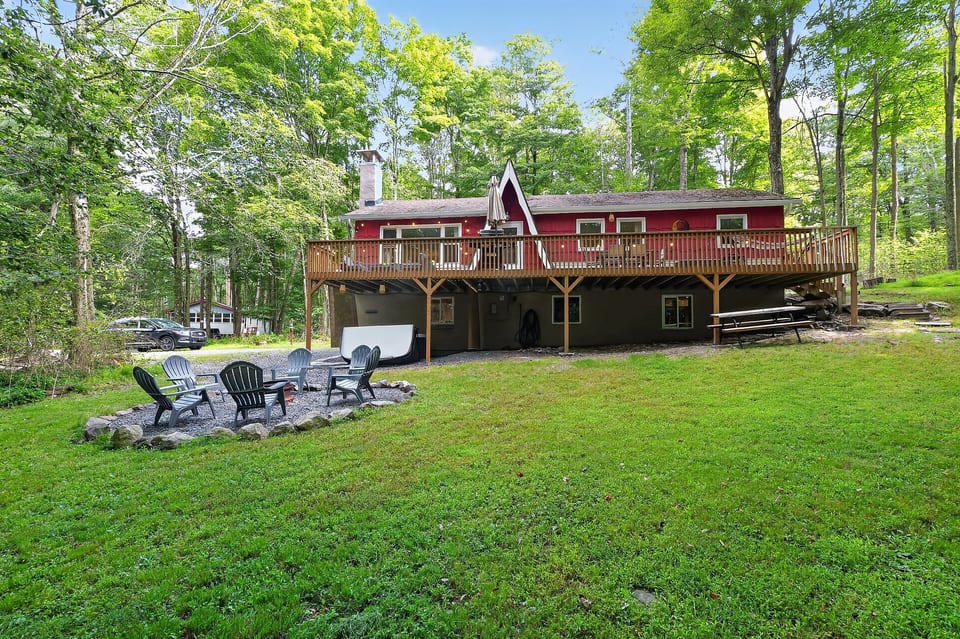 Wooded cabin retreat with huge deck, fire pit, and spacious lawn