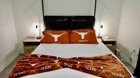 Cozy Texas-themed bedroom with reading lamps and stylish accents