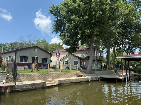 Spacious waterfront home with private dock, boat slip, and shady yard