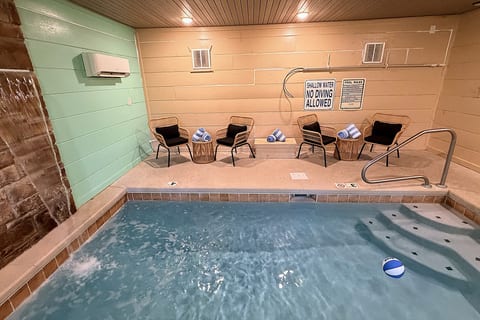 Cozy indoor plunge pool with lounge seating and spa-like vibes