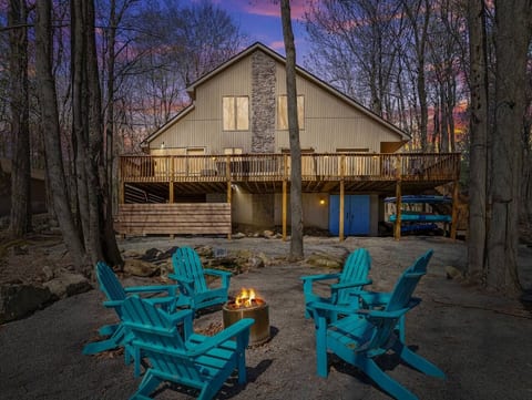 Enjoy the solo stove under the stars in a serene wooded setting. Six new Durogreen Adirondack chairs with side tables. Nine Adirondack chairs in total on the property.