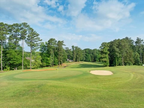 Watch a round from the yard. The green and bunker sit right there.