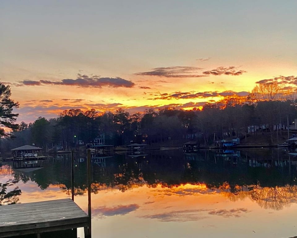 Watch the sun drop over the lake.