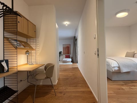 Modern hallway with built-in workspace and cozy bedroom views
