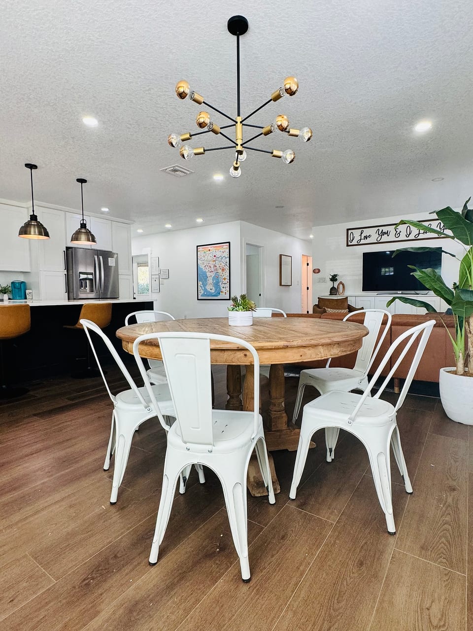Bright open dining space with seating for 6 and stylish modern lighting