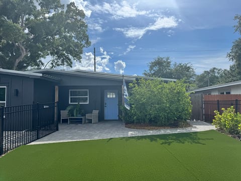 Modern exterior with private fenced yard and inviting front patio