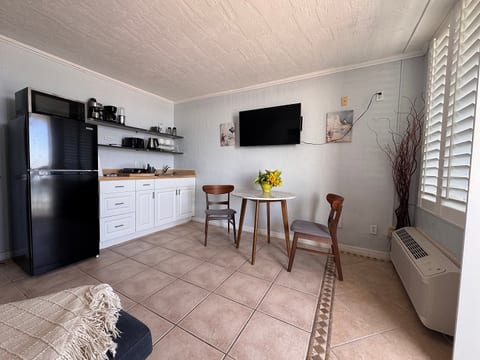kitchenette with a cute little eating area if you don't want to eat on the balcony.