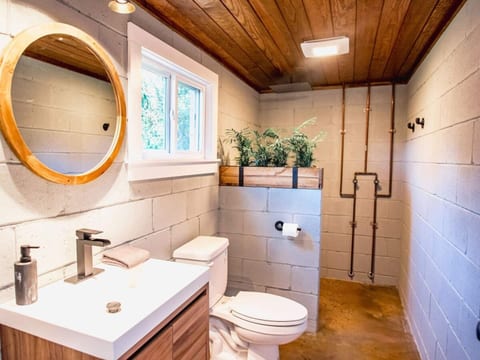 The rustic, exposed industrial look is highlighted best with the bathroom. It is both spacious and functional. And our guest consistently rave about the oversized rain-down shower head!