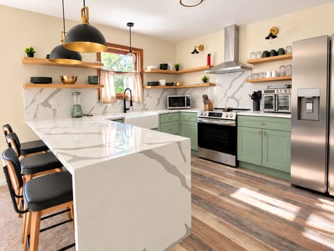 Bright kitchen with everything you would need to cook breakfast, lunch, and dinner.