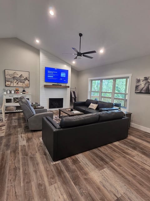 Living room with 65' smart TV w Roku. Zero gravity recliners while enjoying the mountain views.