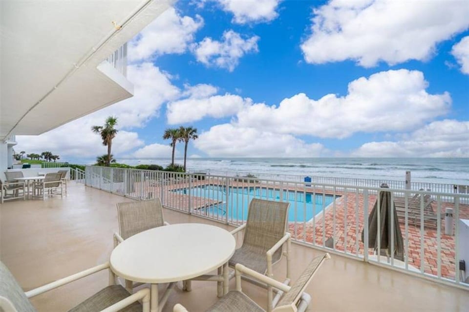 Community sitting area just off pool deck area overlooking the beach.