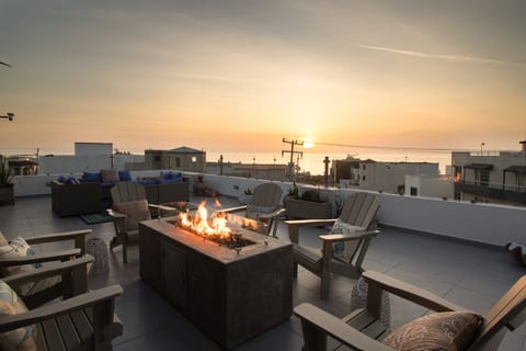 Gather around the rooftop fire pit for drinks and evenings under the stars
