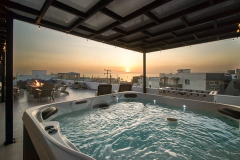 Relax in the private rooftop hot tub while taking in Pacific Ocean views