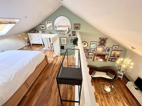 bedroom with a view down to the lounge