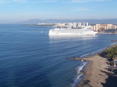 From the balcony, you can wave to the cruise ships as they sail into port.