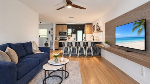 Living Room: Stylish space with vibrant decor and beach views for fun-filled gatherings!