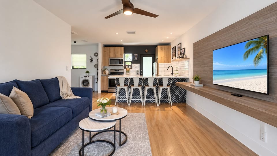 Living Room: Stylish space with vibrant decor and beach views for fun-filled gatherings!