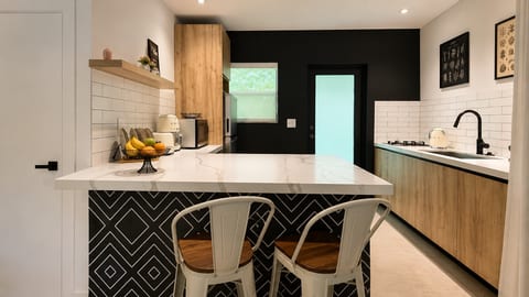 Kitchen: Sleek design with modern appliances and a stylish island for culinary adventures!