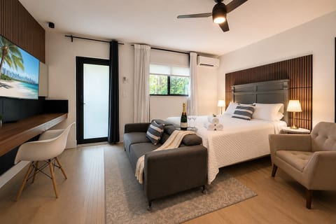 studio: Chic retreat with a plush bed, stylish decor, and cozy sitting area—perfect for relaxation!