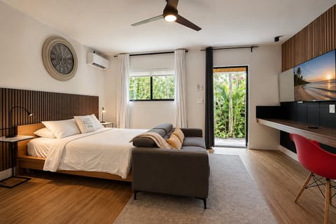 Bedroom Retreat: Modern design with lush views, perfect for relaxation and entertainment!