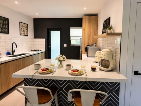 Kitchen: Modern elegance awaits with chic decor, sleek appliances, and a stylish dining experience!