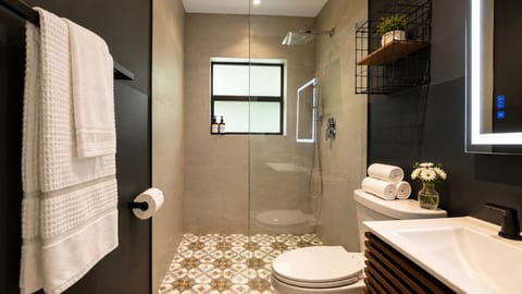 Bright & Modern Bathroom: Refresh in style with chic decor and vibrant tile flooring!