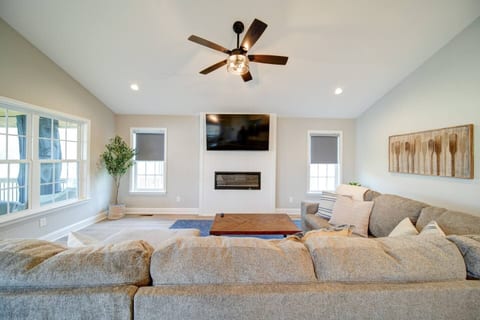 Living room with large sectional and 65" smart TV
