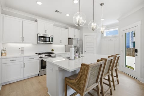 There's plenty of prep space in the kitchen with quartz countertops and a large island with space for prep and dining.