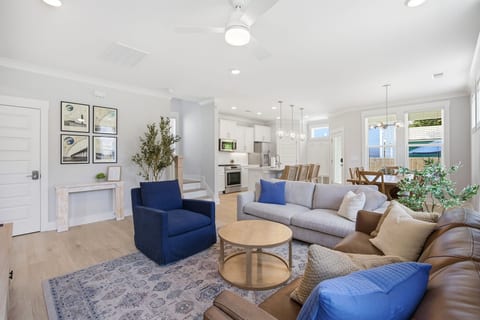 The open living space has a smooth transition to the kitchen and dining room.