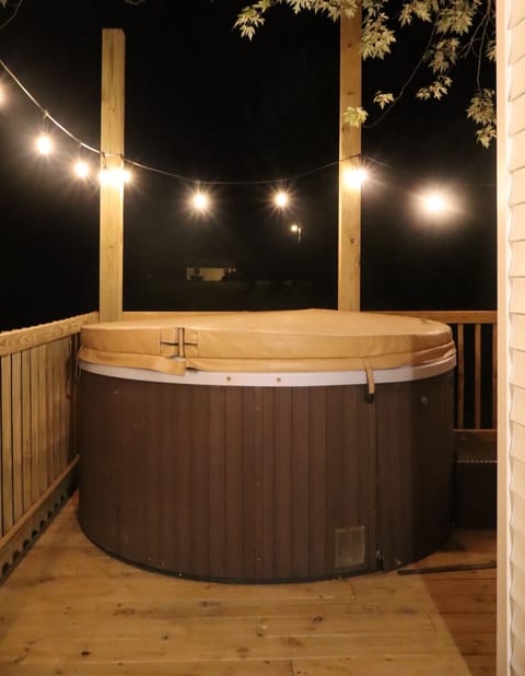 Soak in the private hot tub under the stars after a day of adventure.