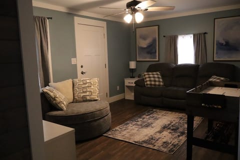 Unwind in the inviting living room with a Smart TV, comfortable seating, and fun games for everyone.