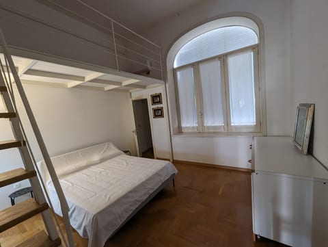 First Bedroom with king sized bed, walking closet and private bathroom