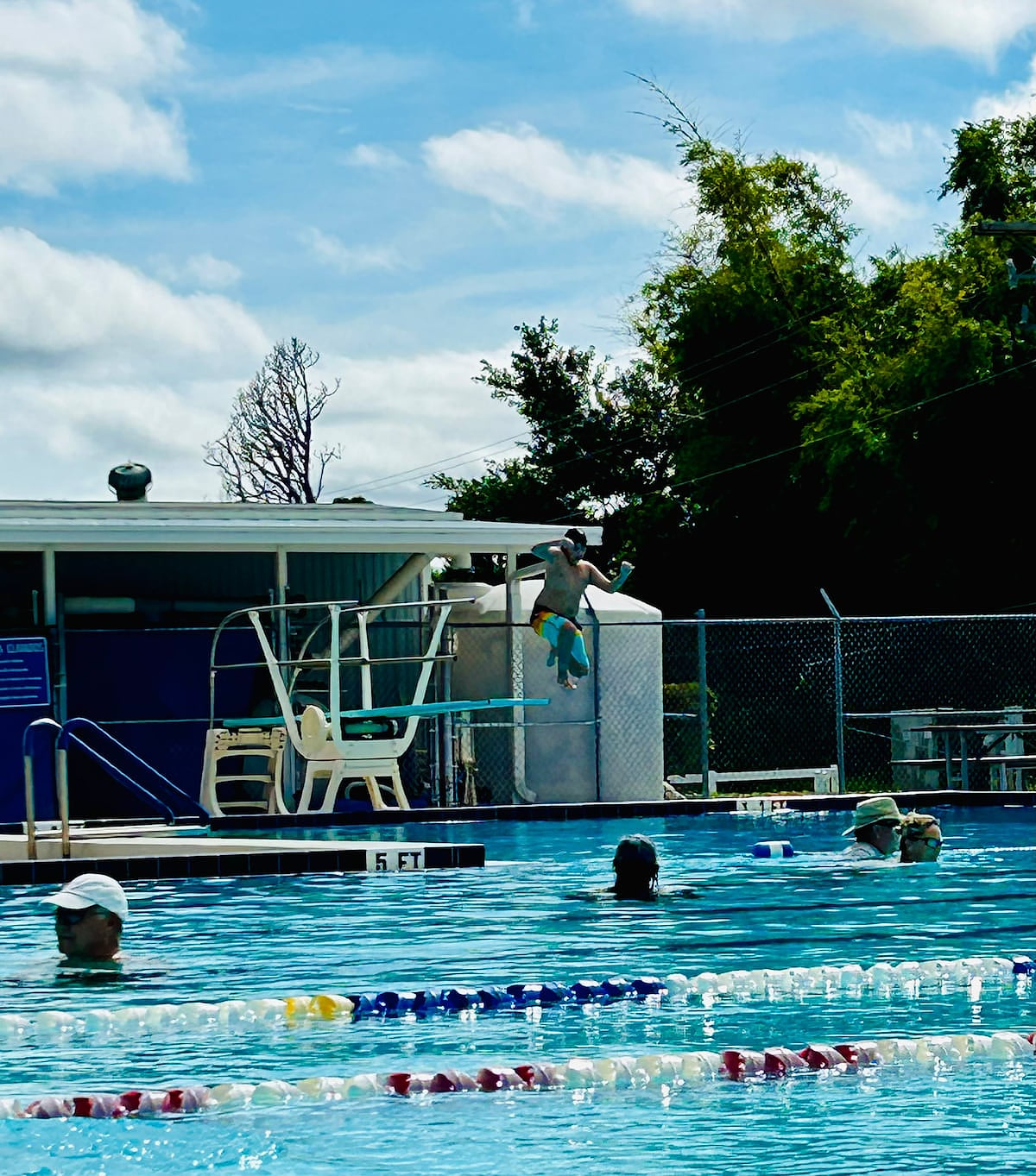 This is the other community pool at the center They have diving board and a couple water slides.