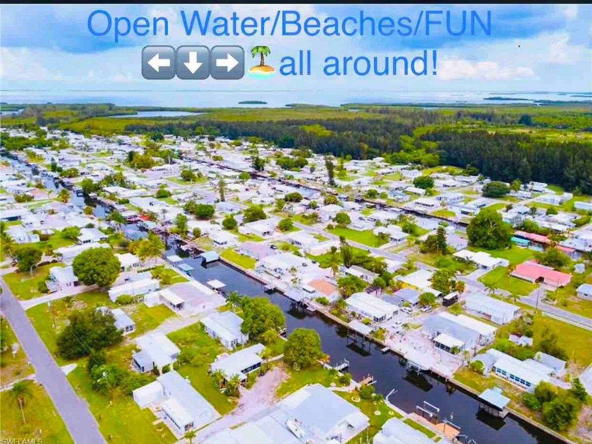 Please note how our community is set up with 2 houses on the waterside and 2 houses on non waterside. Our home is located more towards the street on the waterside, with our path down to our dock. It is the first house on the left in this picture.