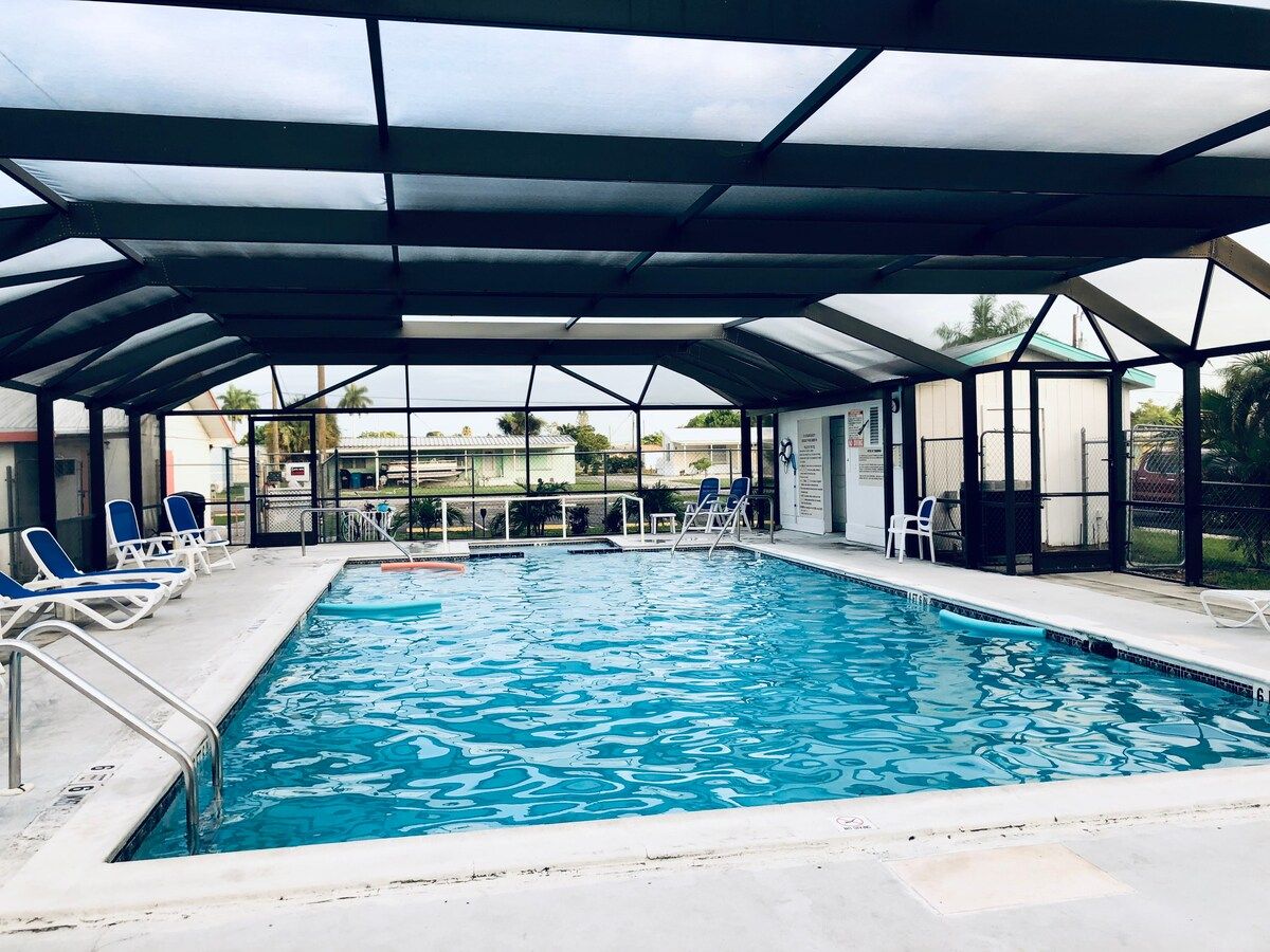 Our Pool!! This pool is always warm and fun to swim in or just kick back and relax!