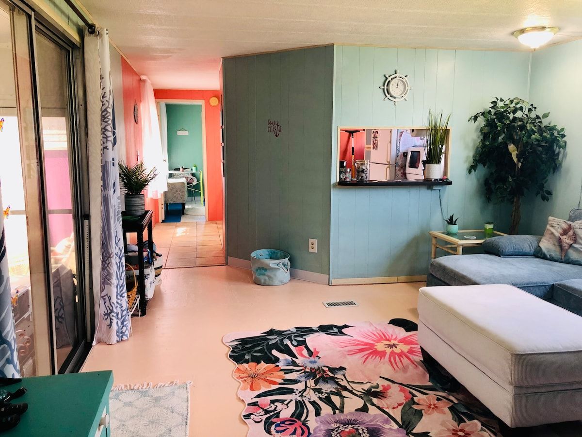 Peekaboo space to kitchen....dog toys and a dog bed provided in this space as well