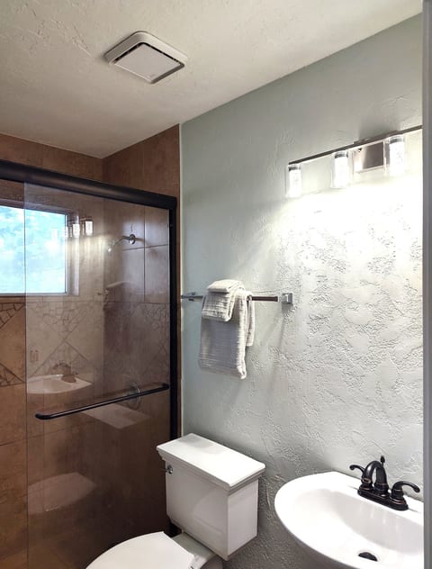 Dedicated bath features a walk-in shower.