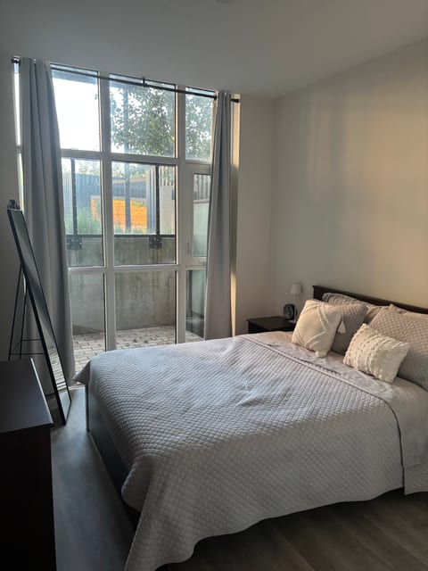 Bedroom With Ceiling to Floor Windows