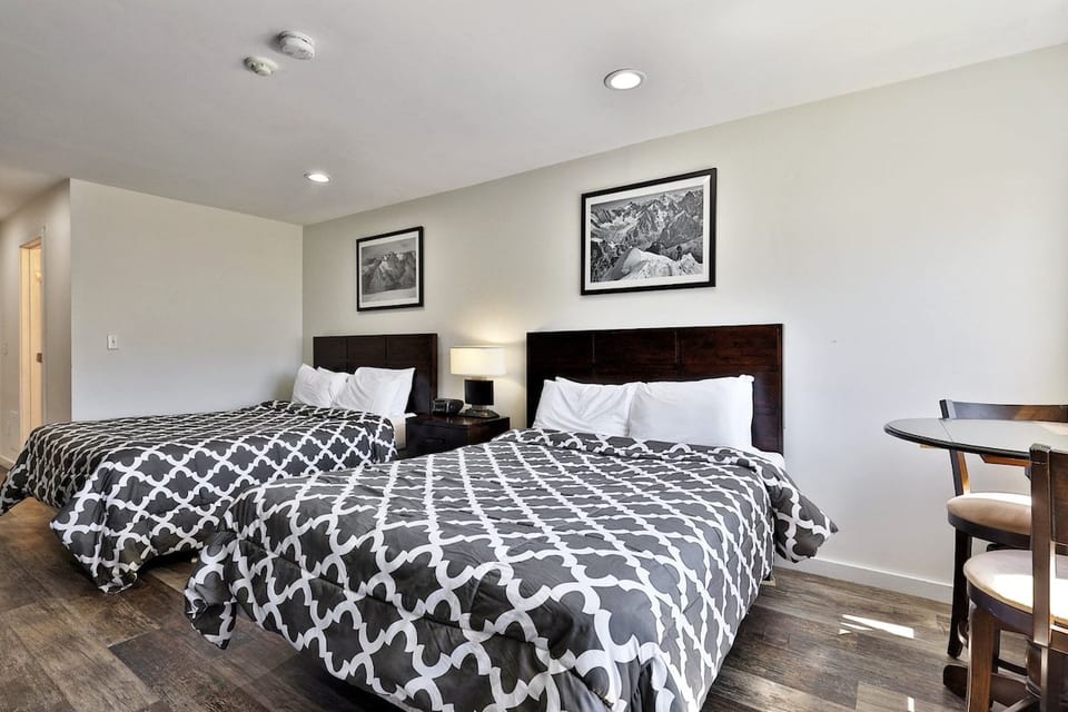 Two queen beds share this open studio, with space for up to four guests.